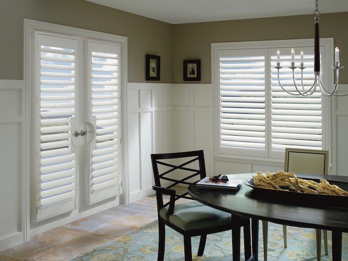 Dinning room with shutters on French door and windows